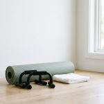 Home gym corner with push-up bars and exercise mat — chest exercises guide, Gynecomastia LA